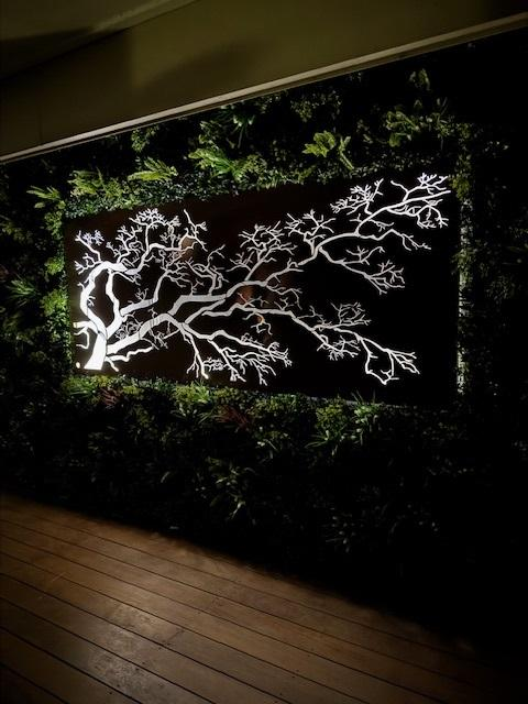 How to Style Outdoor Walls with Lush Spring Green Panels and LED Art