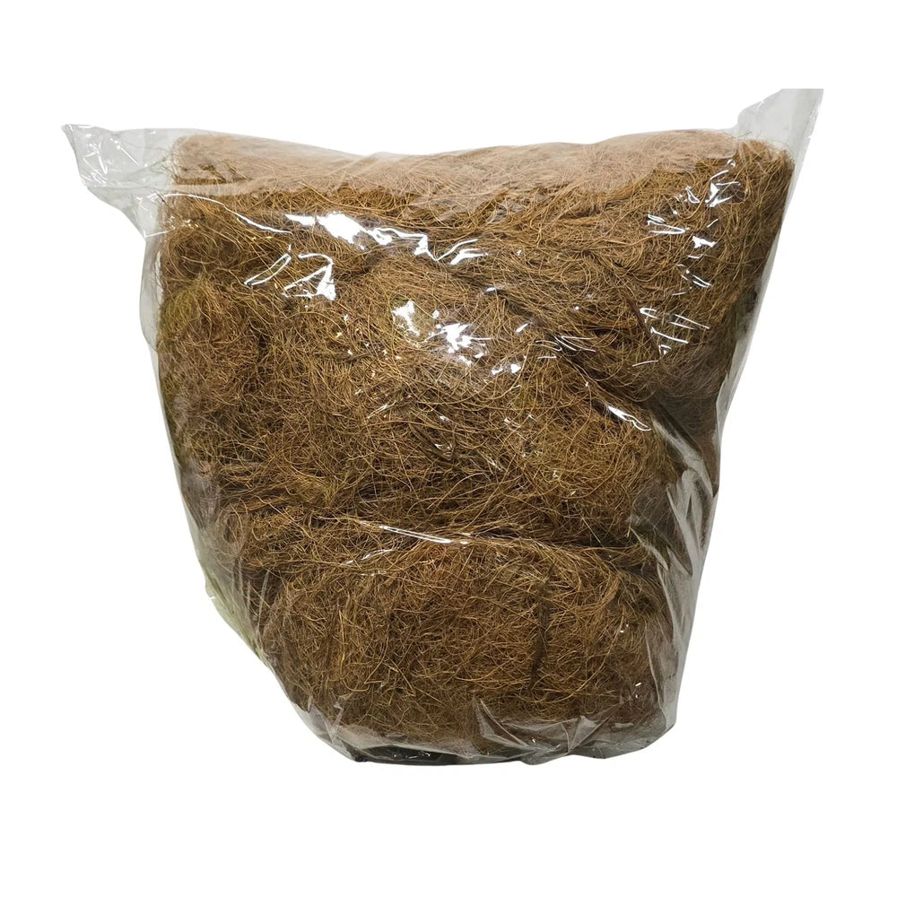 A clear plastic bag filled with brown coir or fibrous plant material, photographed against a plain white background.