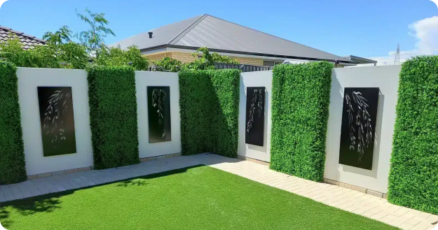 modern garden with artificial grass and water feature panels