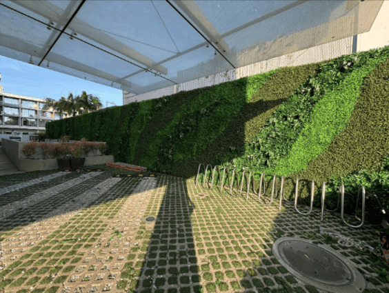 Wavy Wonders: A Fluid Green Wall Installation Using Mixed Foliage Panels