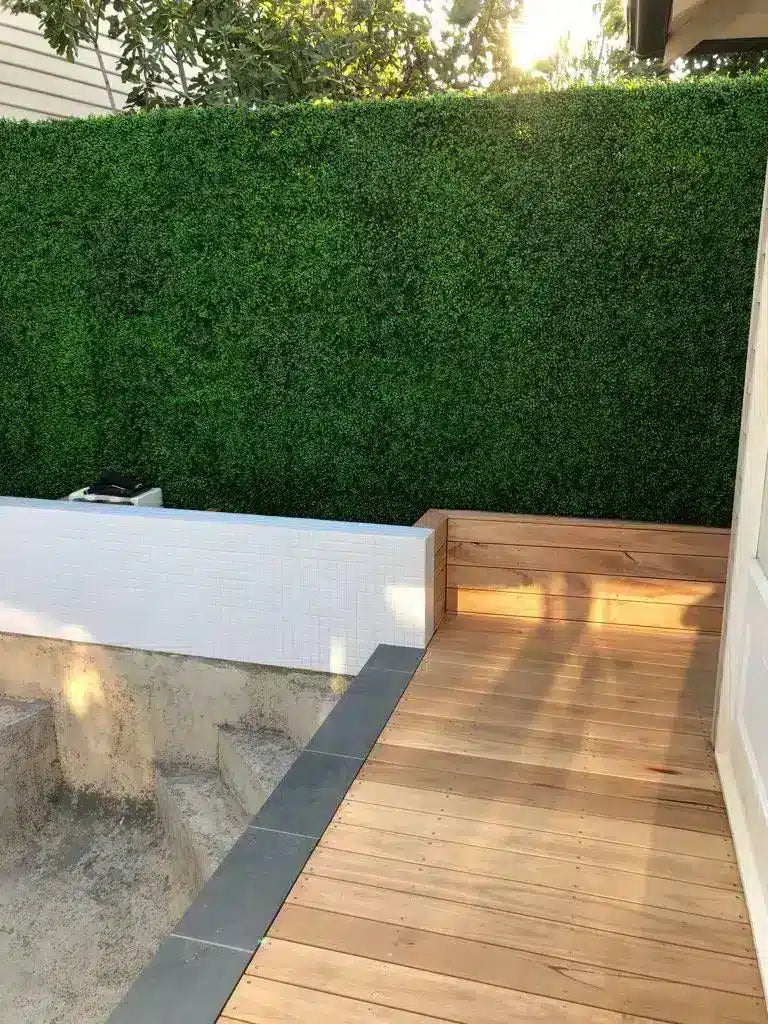 Fake buxus and boxwood hedge in and around a pool renovation