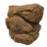 A bundle of brown coir fiber or coconut husk material, photographed against a plain white background.