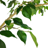 Artificial green leaves on a faux tree branch, isolated on a solid white background.