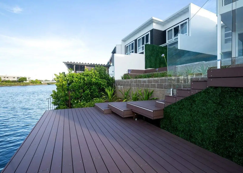 Fake boxwood hedge along a backyard for a residential property