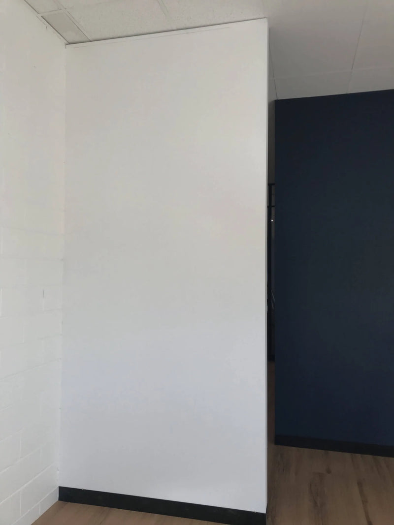 Before – Artificial boxwood wall installed onto an office wall