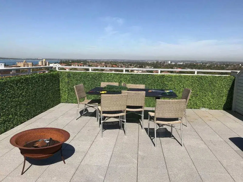 After – Balcony with artificial boxwood privacy hedges