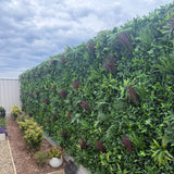 Artificial green plant wall panels for outdoor garden privacy screening.