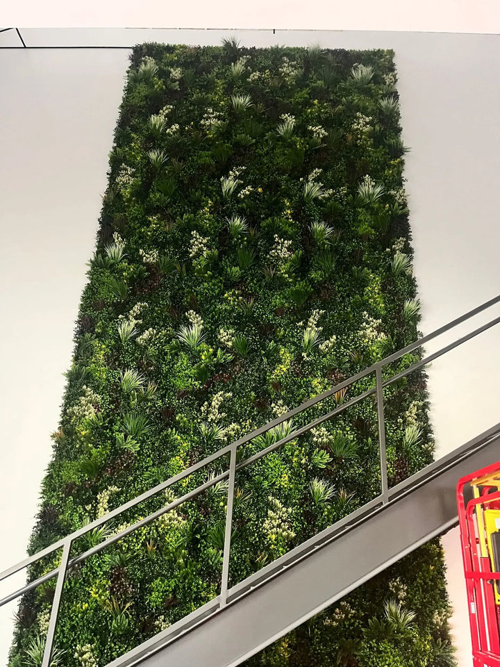 Green wall with various plants in a modern indoor setting