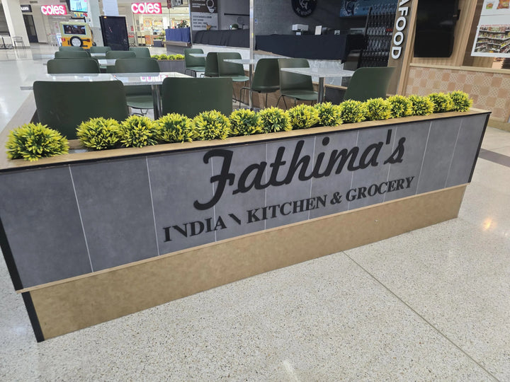 Bright & Fresh: Yellow Lily Plant Display at Fathima’s Food Stall