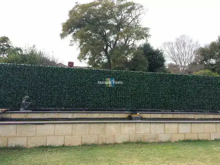 After – Colorbond fence after artificial ivy hedge panels were installed