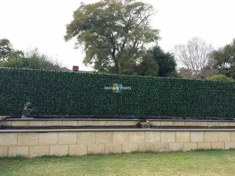 After – Colorbond fence after artificial ivy hedge panels were installed