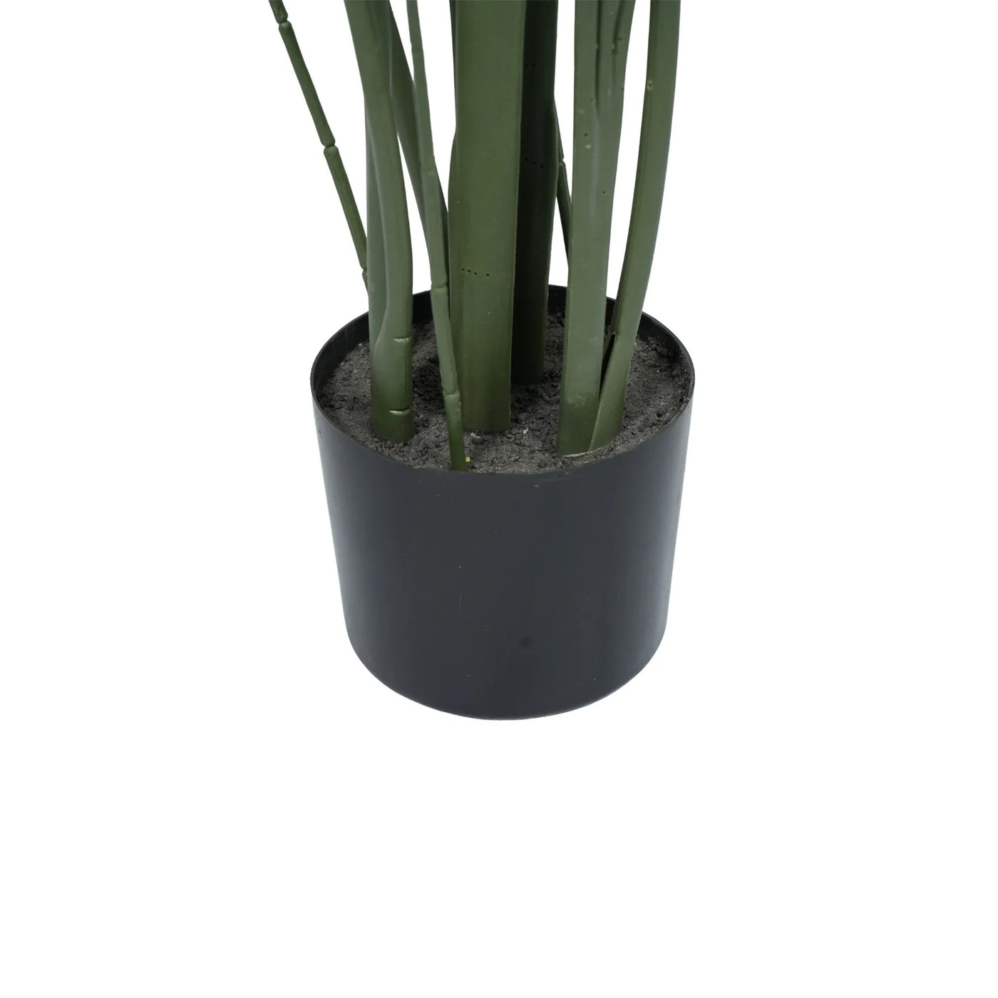 An artificial green plant with long, slender leaves in a matte black cylindrical pot filled with gray faux soil, shown against a plain white background.