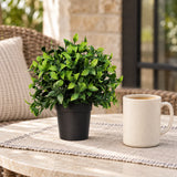 20cm potted artificial jasmine with green foliage on a patio table; cup and furniture are styling props.