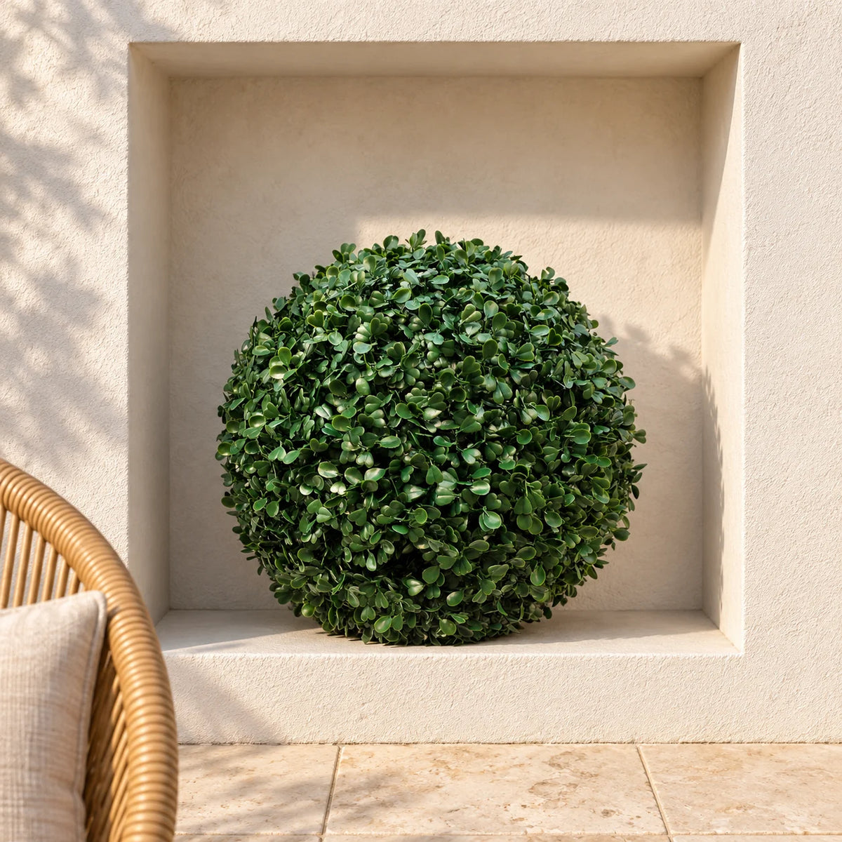 40cm artificial boxwood topiary ball in a square courtyard niche.