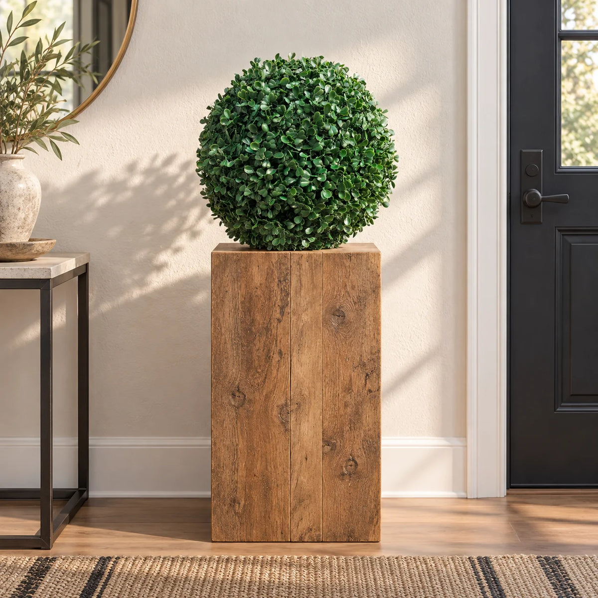 40cm artificial boxwood ball on a timber plinth in a residential entryway.