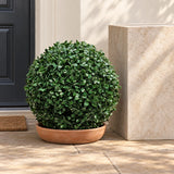 40cm artificial boxwood ball in a low terracotta bowl on a sheltered porch.