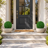 Set of two 15-inch UV-resistant artificial boxwood topiary balls at a US entry courtyard