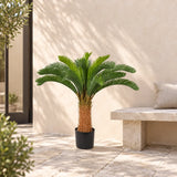 105cm artificial cycad palm in its black pot beside a courtyard bench.