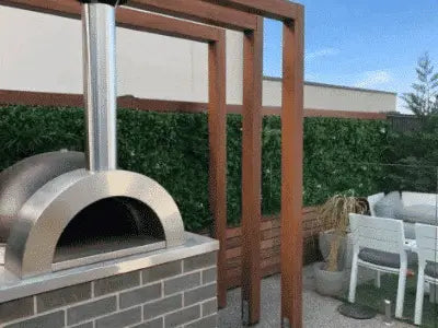 Outdoor entertaining area with artificial green walls and fake grass