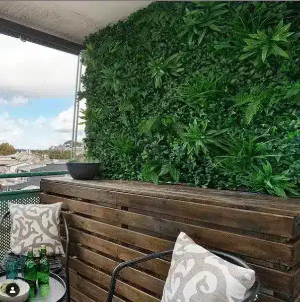 Hedges create a nice finished look for home balcony.