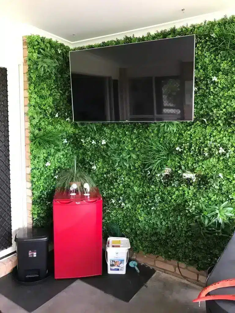 White oasis green wall mounted on a brick wall