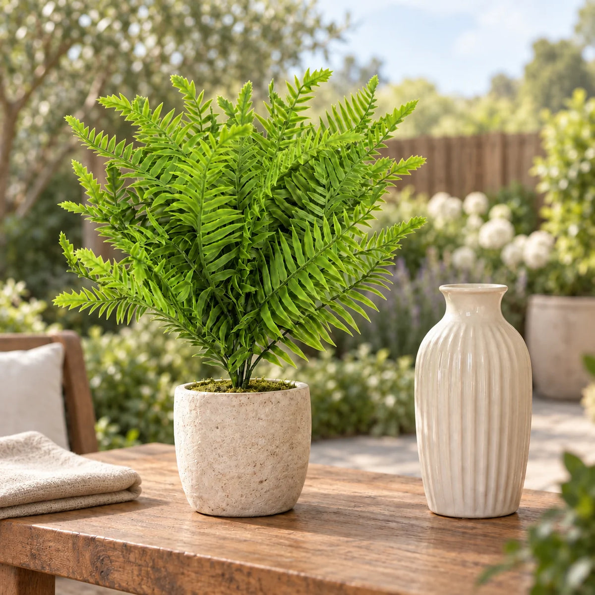 40cm artificial lady fern stem styled in a small stone pot on an outdoor patio console.