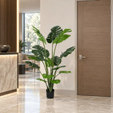 59.1-inch Monstera artificial tree in its black nursery pot in an indoor hotel lobby