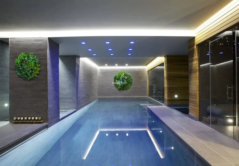 Indoor pool with artificial green wall circle
