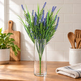 50cm artificial purple lavender stem in a clear vase on a kitchen bench.