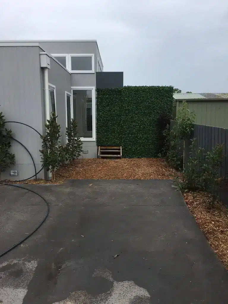 Spring sensation fake hedges on timber fence to prevent access to their rear yard