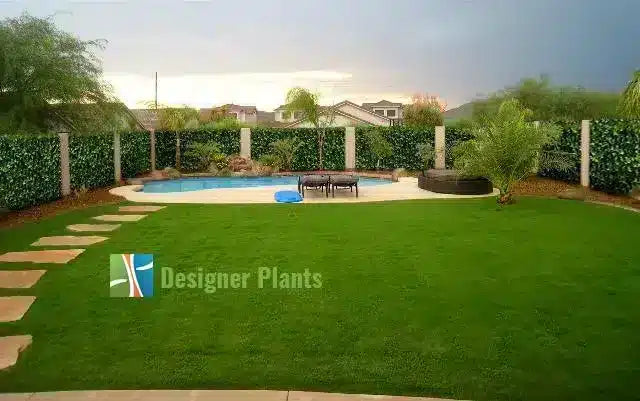 After – Artificial Ivy provides instant greenery to a backyard fence.