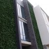 Artificial plant wall for a commercial development