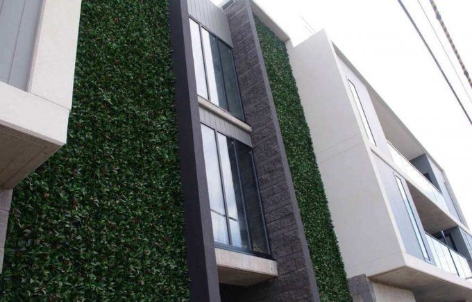 Artificial plant wall for a commercial development
