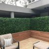 Custom made timber planters with artificial hedge to screen of an area