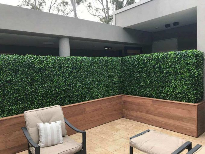 Custom made timber planters with artificial hedge to screen of an area