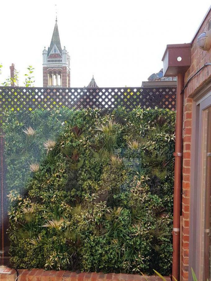 Vertical garden green wall with hand made foliage