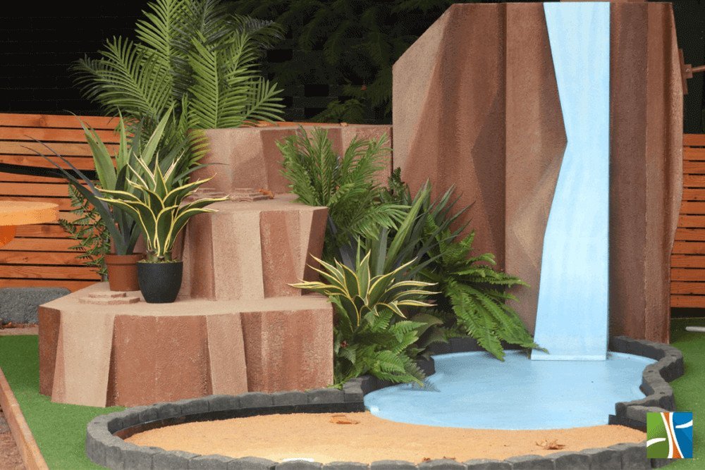Artificial plants for hire - Disney pixar display at event fake plants with lake