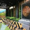 Artificial / fake tall cypress tree used in a pool area