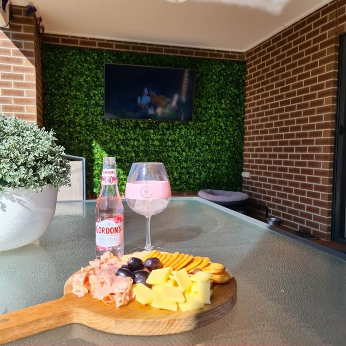Artificial Hedge panels installed on a backyard patio