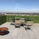 artificial boxwood hedges have been installed to create privacy