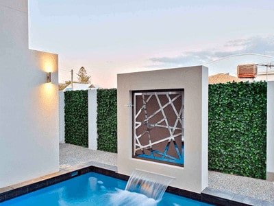 Artificial Vertical Garden next to resident pool