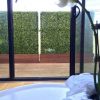 Fake Boxwood hedge with planters