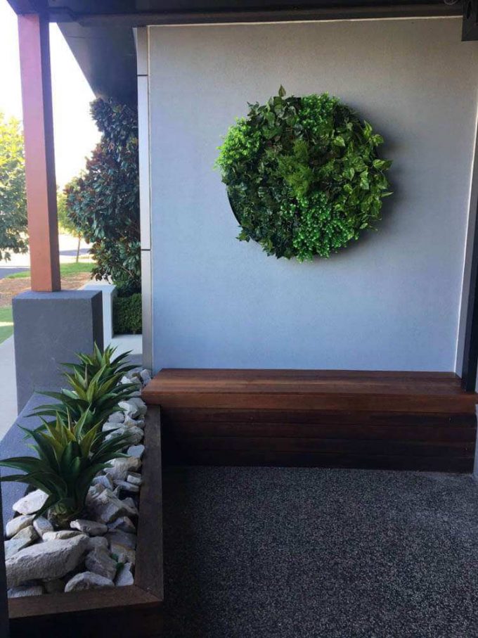 Artificial UV resistant agaves planted along with a stunning green wall disc - High quality artificial plants and vertical garden discs.