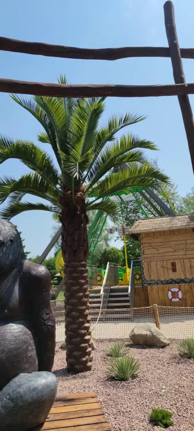 Very tall artificial palm tree at a zoo in germany