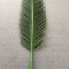 Artificial plastic leaf of a palm tree