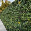Premium Artificial Green Wall Panels Installed onto a fence