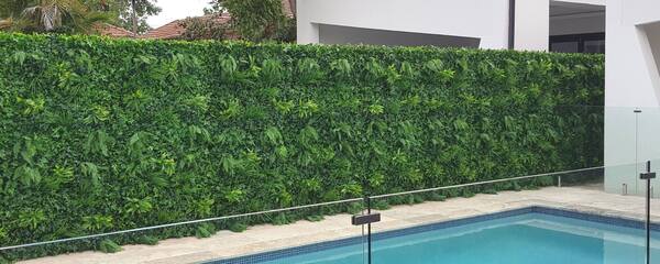 tropical oasis vertical garden on pool