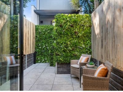 Create your outdoor haven with an artificial green wall