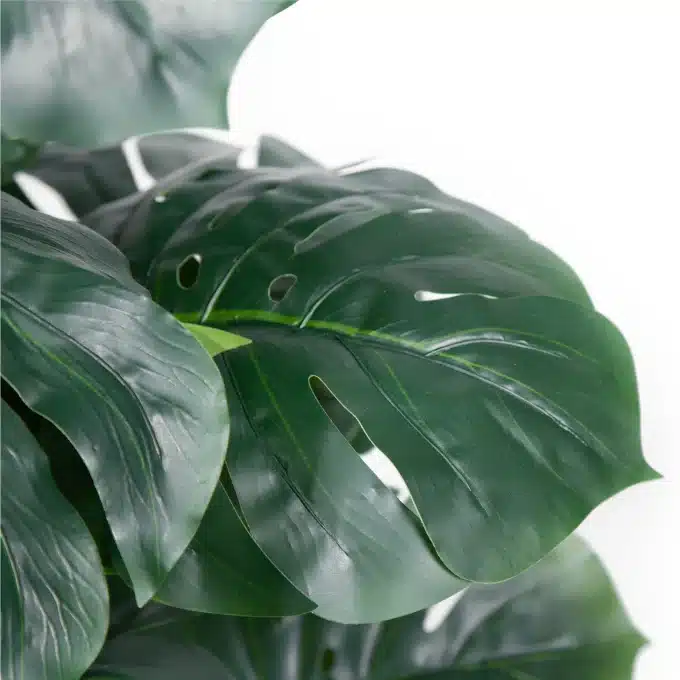 Artificial Monstera deliciosa, a durable decor plant for any setting.