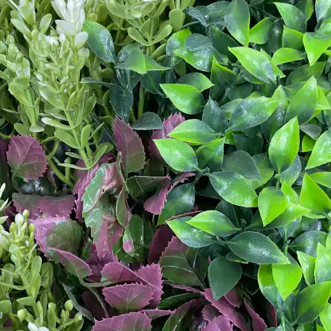 Hyper-realistic faux plant wall detail of foliage